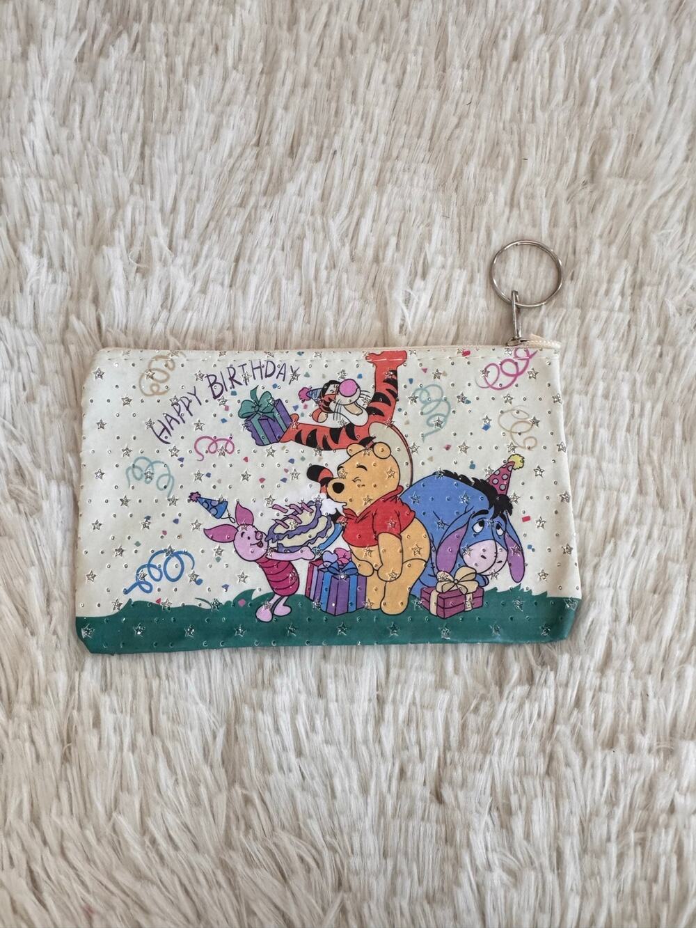 Winnie the Pooh birthday keychain pouch celebrating with gifts balloons